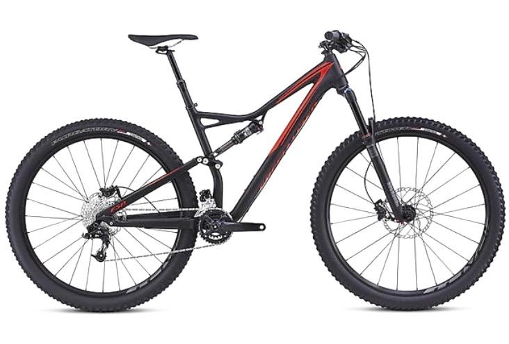Specialized Stumpjumper FSR Comp 29er: A sleek mountain bike with a black and red frame, featuring wide tires, disk brakes, and a suspension system designed for off-road riding.