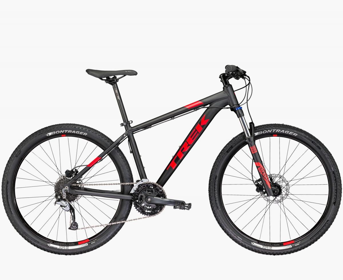 Trek 2017 Trek Marlin 7: A black and red Trek mountain bike featuring a lightweight frame, front suspension, and Bontrager tires. The bike is positioned upright to showcase its design, including the gear setup and disc brakes.