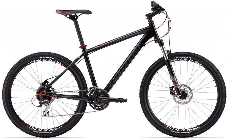 Specialized Stumpjumper FSR: Alt text: A black mountain bike with a modern frame design, featuring thick tires and disc brakes, positioned on a white background.