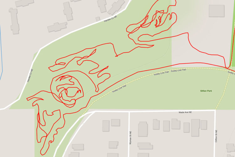 Map showing a trail marked in red, depicting a winding path through Gillian Park, with nearby streets labeled. The trail features a spiral shape and meanders around grassy areas within the park.