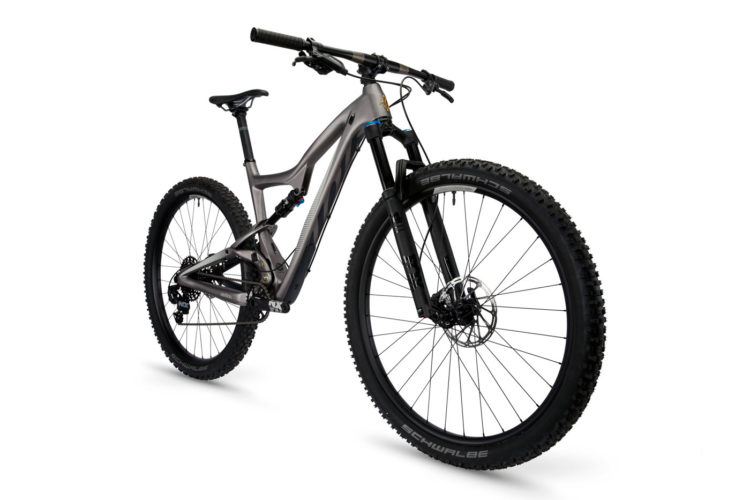 Alt text: A modern mountain bike featuring a sleek gray frame, wide tires, and a sturdy front suspension fork, positioned against a white background.