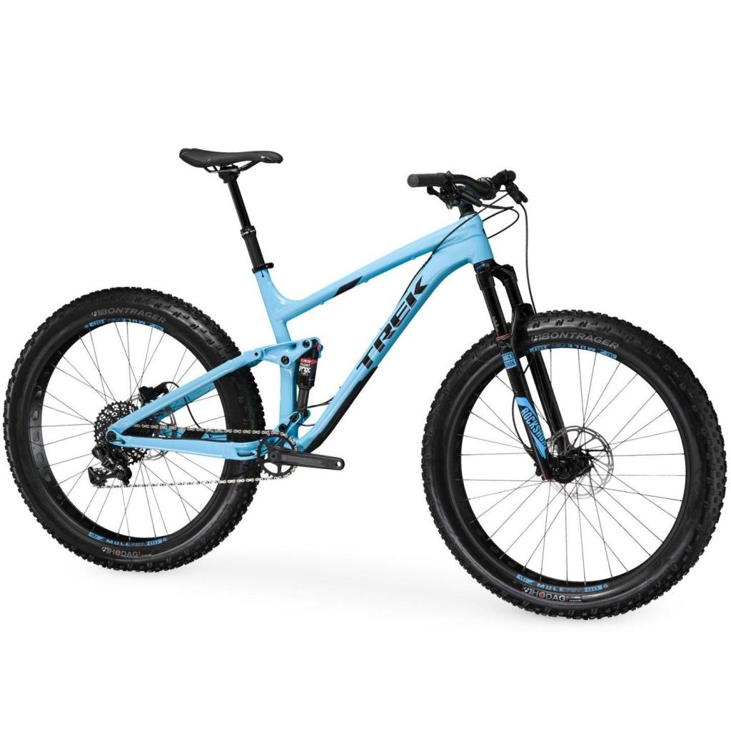 Trek Farley EX8: Image of a blue mountain bike featuring a sleek frame, wide tires, and a front suspension fork. The bike has a modern design with details in black, showcasing brand logos. It is positioned on a plain background, emphasizing its features.