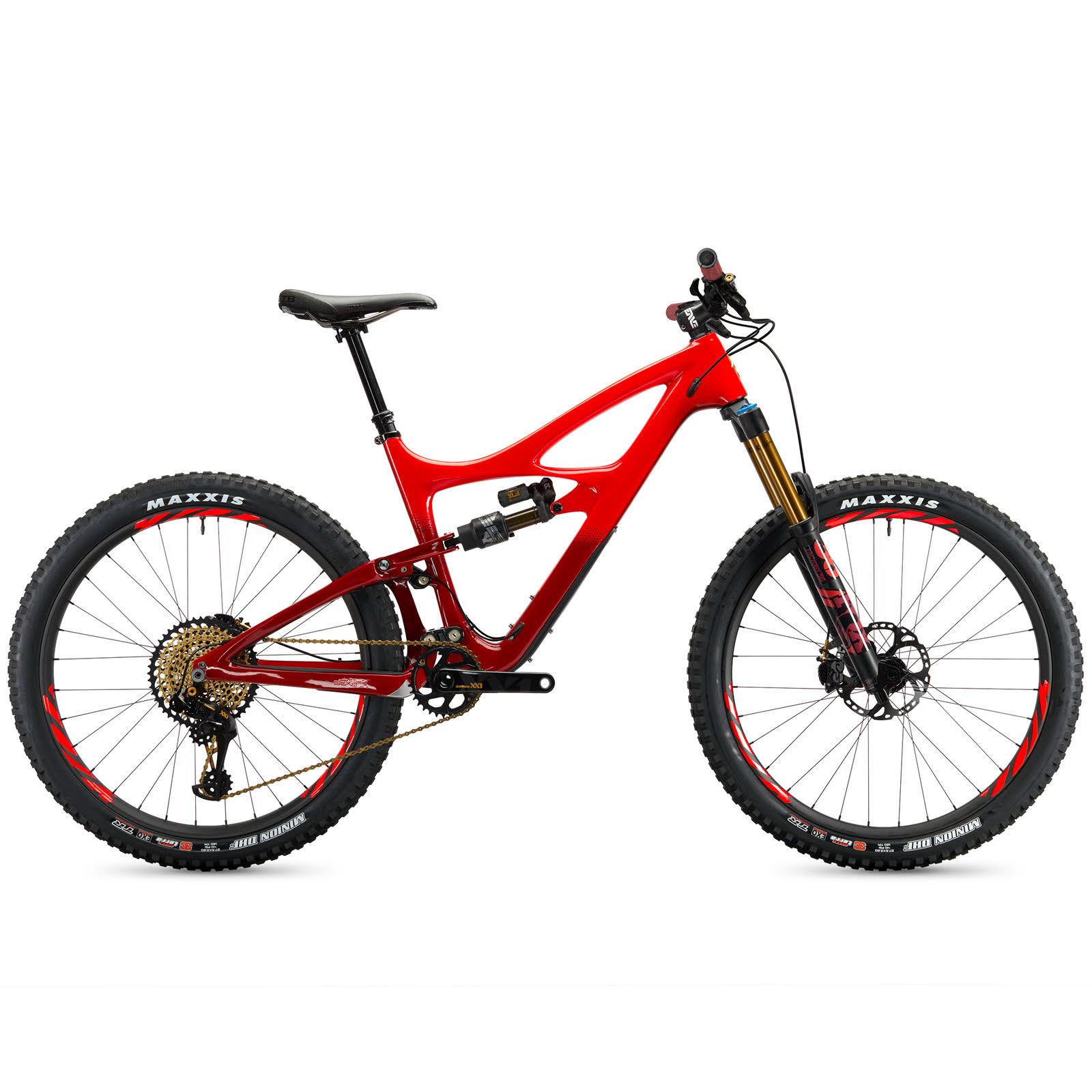 Ibis Mojo HD4: A sleek red mountain bike featuring a lightweight frame, wide tires, and advanced suspension system, designed for off-road performance. The bike includes high-quality components and is positioned against a plain background.