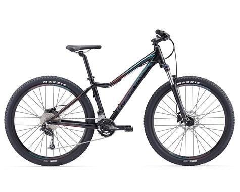 Giant Liv Tempt 3 2017: A sleek mountain bike with a black frame and colorful accents, featuring wide tires specifically designed for off-road terrain, disc brakes, and a gear system. The bike is positioned on a plain background, showcasing its design and build.