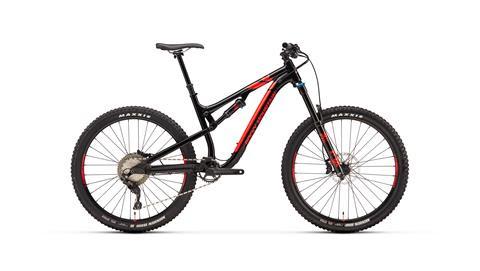 Rocky Mountain Altitude: A side view of a black and red mountain bike with large tires, featuring a durable frame, suspension forks, and disc brakes. The bike is displayed on a plain background.