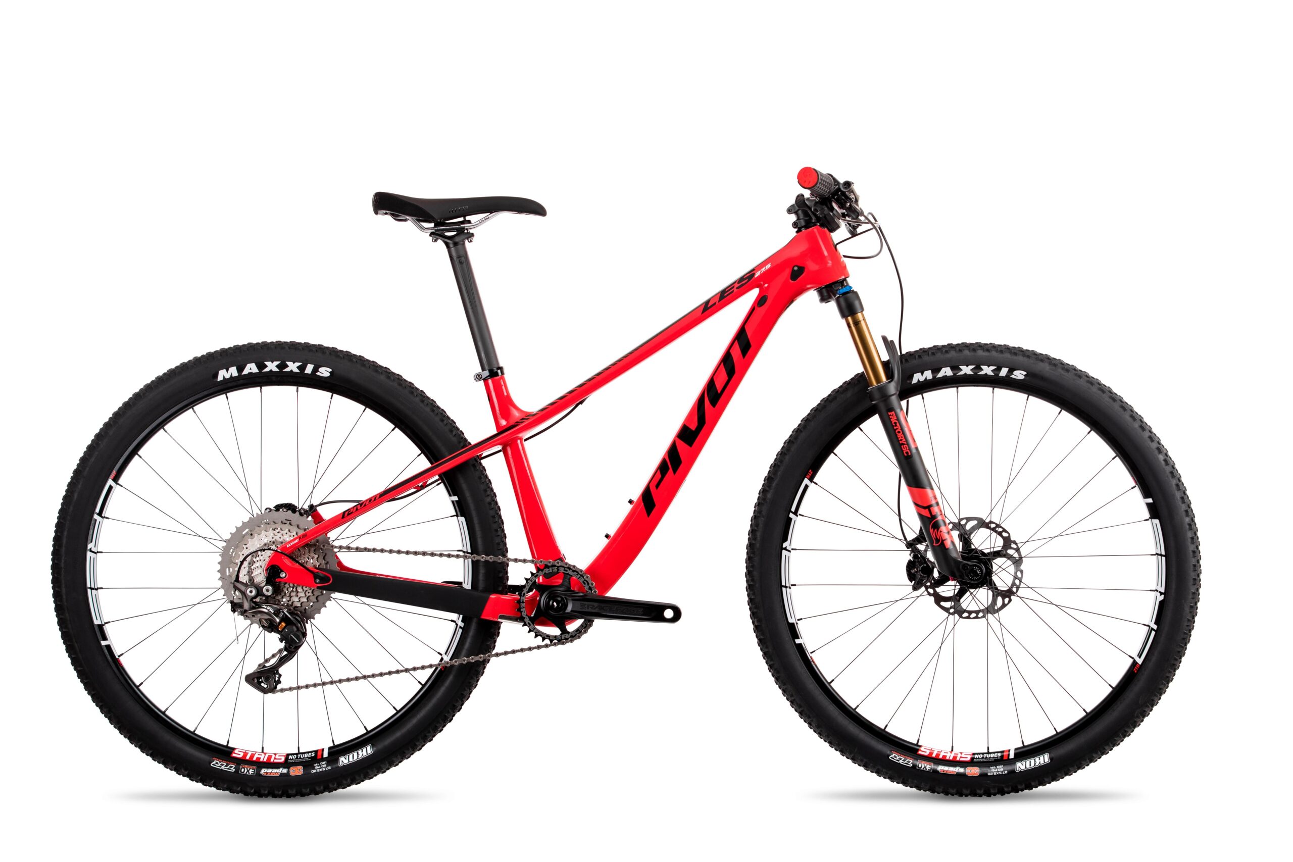 Pivot LES 27.5: A red mountain bike with a lightweight frame, featuring Maxxis tires, a front suspension fork, and disc brakes. The bike is shown from the side against a white background, highlighting its sleek design and components.