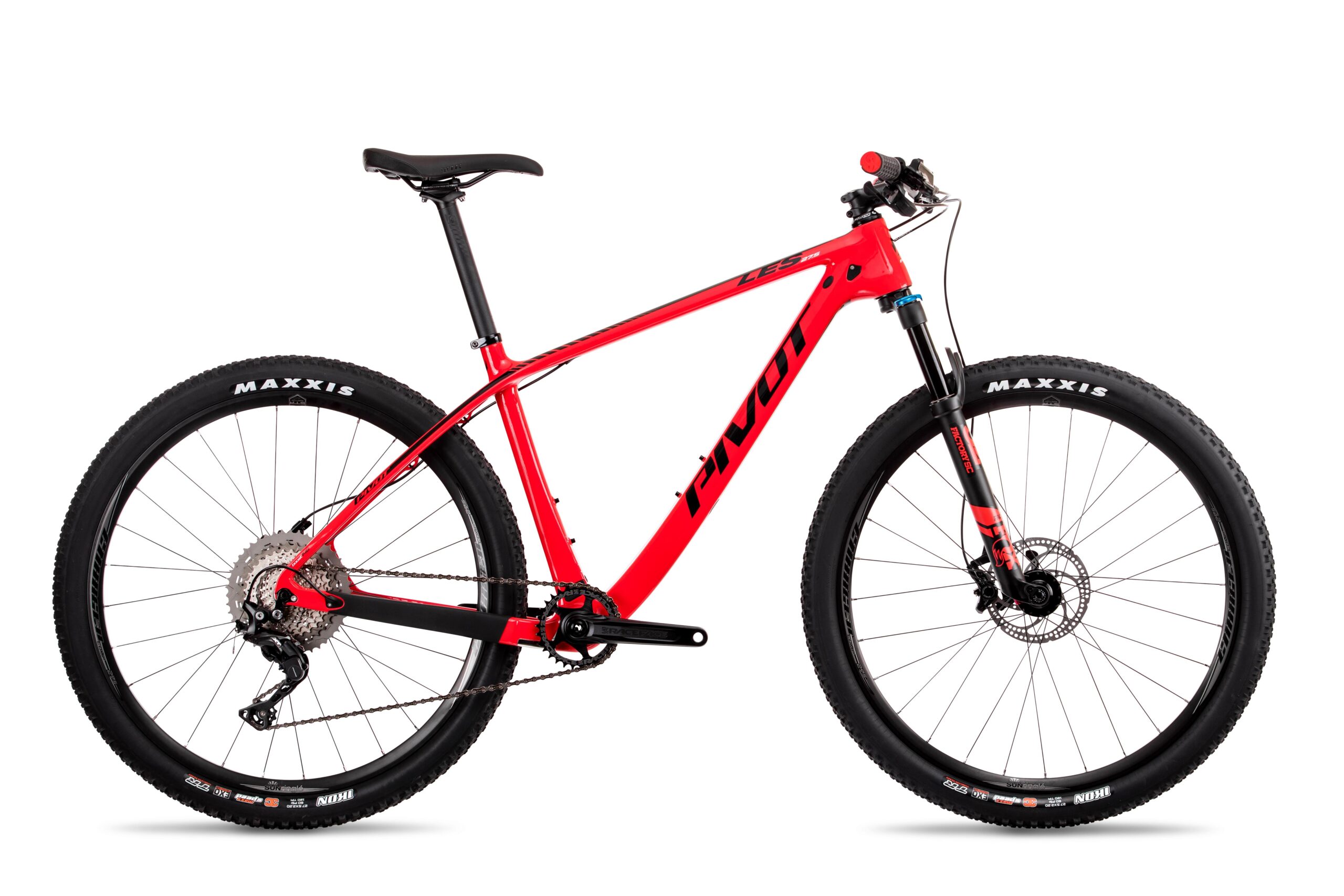 Pivot LES 27.5: A red mountain bike with a lightweight frame, featuring a front suspension fork, wide tires labeled "MAXXIS," and a black seat. The bike is set against a plain white background.
