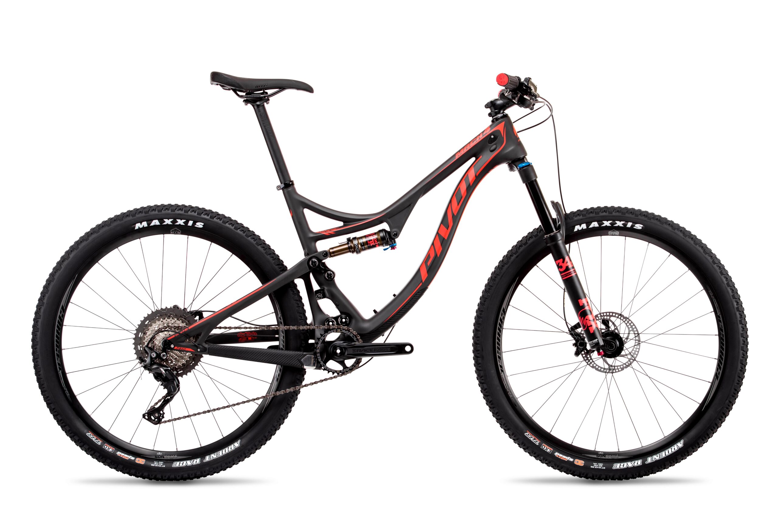 Pivot Mach 4: A side view of a modern mountain bike featuring a sleek carbon frame with red and black accents. The bike has wide tires, a prominent suspension system, and is equipped with high-quality components suitable for off-road cycling. The background is plain white, emphasizing the bike's design.