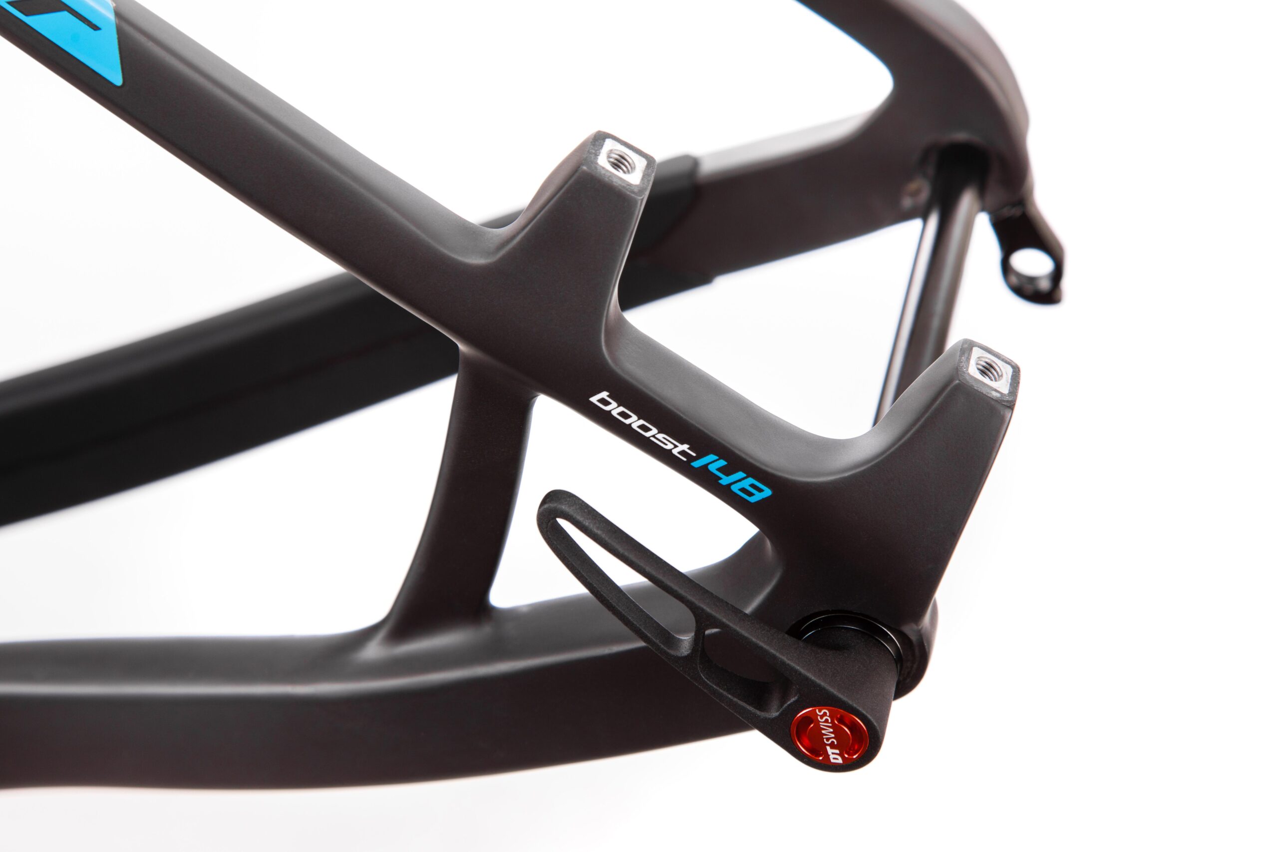 Pivot LES 27.5: Close-up image of a bicycle frame showcasing a boost hub with a sleek black finish and blue text reading "boost 148." The frame features precision engineering and mounting points for components.