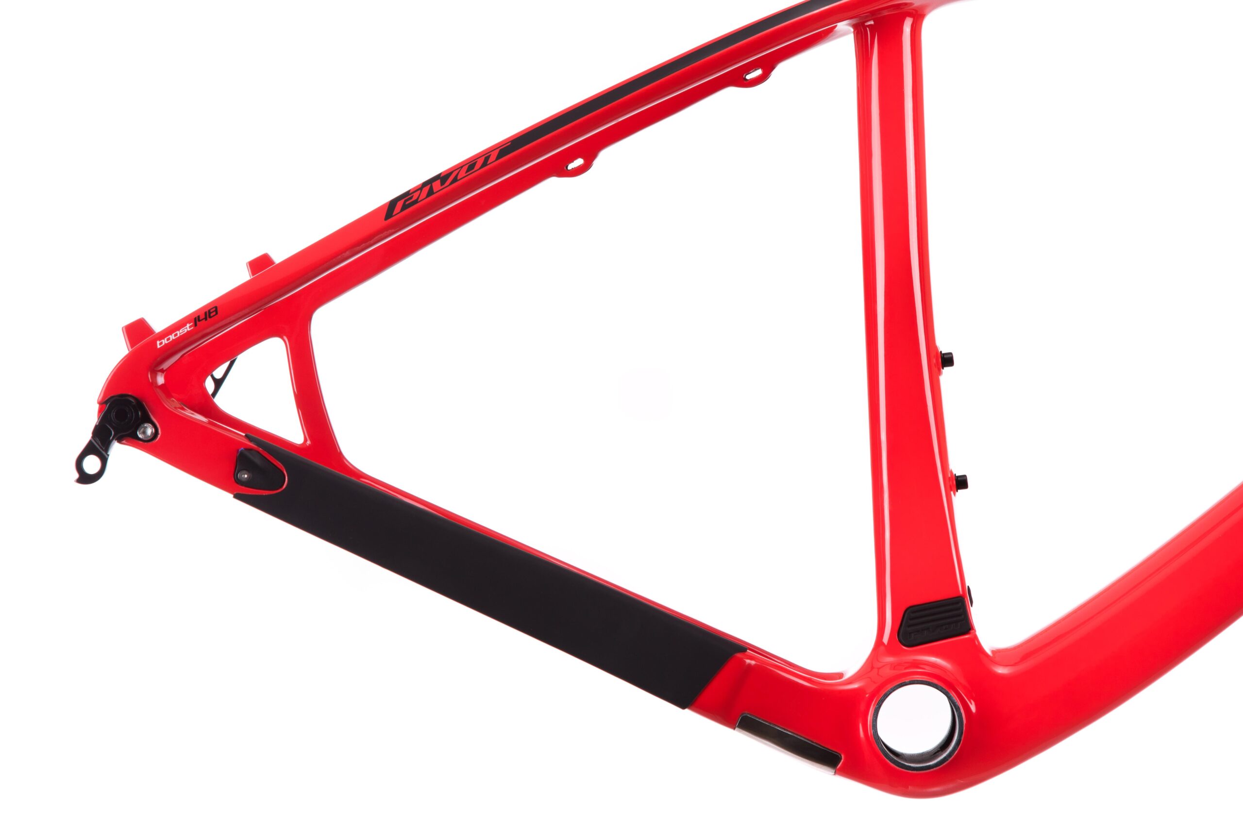Pivot LES 27.5: Image of a bright red bicycle frame featuring a sleek, modern design. The frame has a black section along the bottom and includes various mounting points, showcasing its lightweight and durable construction.