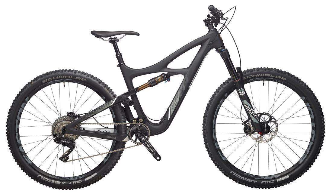 Ibis Mojo 3: A modern mountain bike with a sleek black frame, featuring wide tires designed for off-road terrain, front and rear disc brakes, and a high-performance suspension system. The bike is shown from the side, highlighting its aerodynamic design and advanced components.