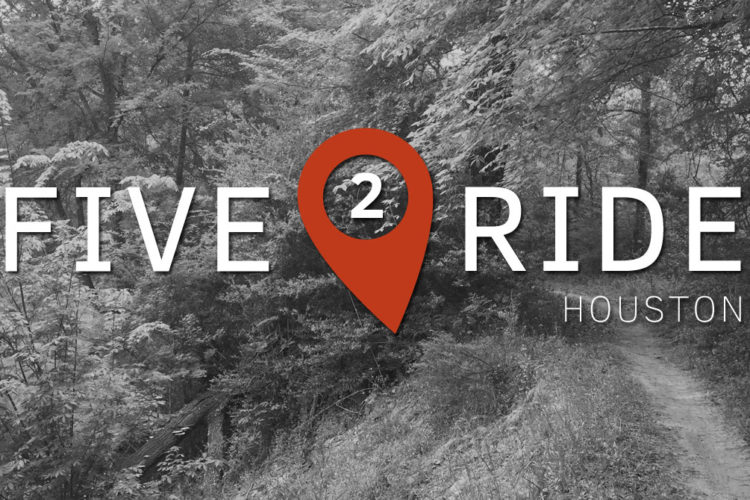 Image depicting a nature path surrounded by trees, featuring the text "FIVE 2 RIDE" in bold white letters, with a red location pin icon where the "2" is placed, and "HOUSTON" in smaller letters underneath. The overall tone of the image is monochromatic with a focus on the contrast between the text and the background.