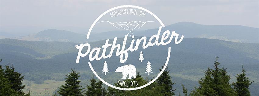 Alt text: "Scenic view of rolling hills and trees under a cloudy sky, featuring a circular logo that says 