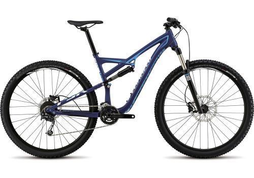 Specialized Camber 29: A blue mountain bike with a lightweight frame, wide tires, and front suspension, positioned on a white background. The bike features disc brakes and a geared drivetrain, suitable for off-road cycling.