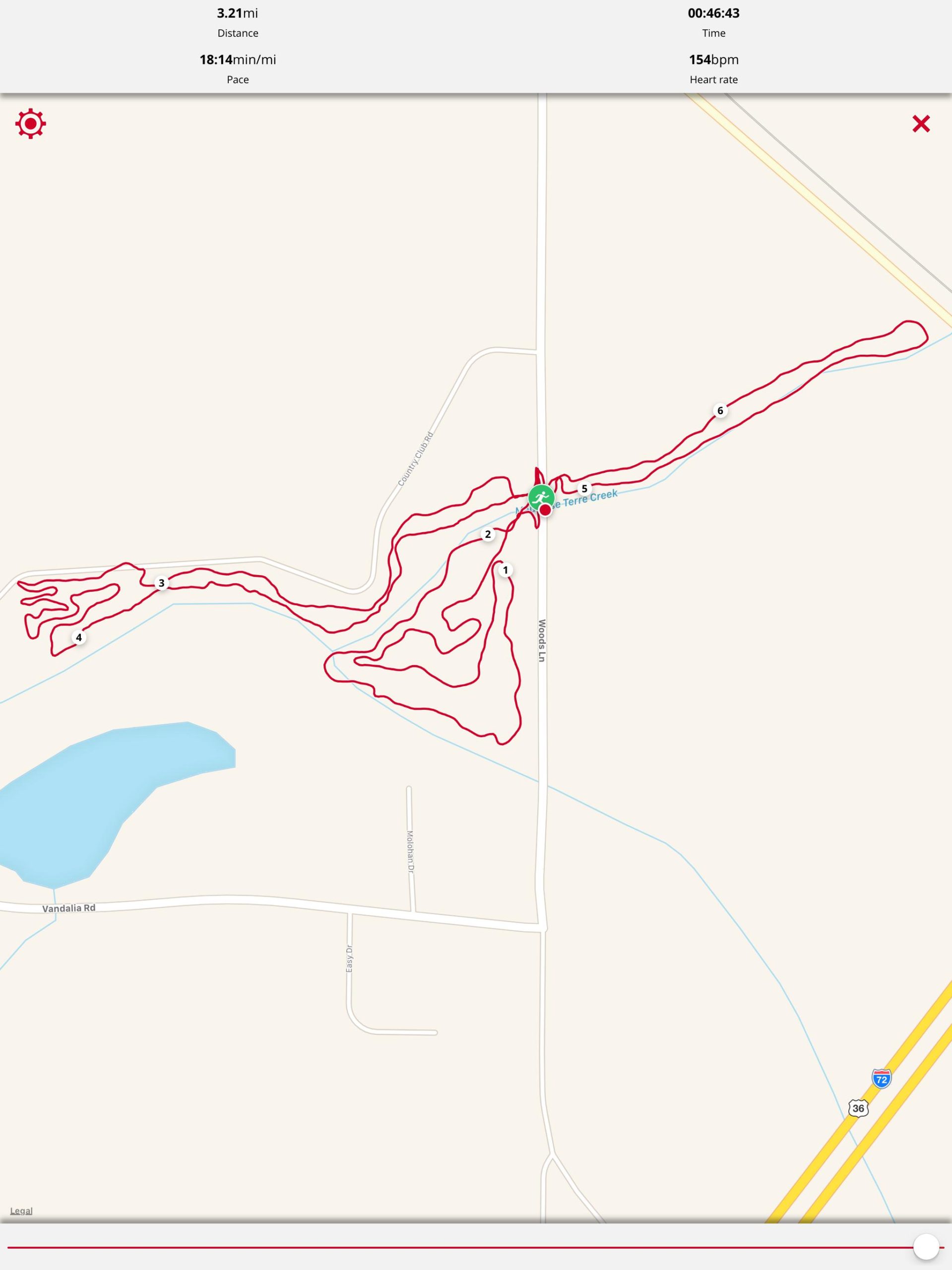 Map showing a tracking route with a distance of 3.21 miles, a pace of 18:14 minutes per mile, and a total time of 46 minutes and 43 seconds. The route is depicted in red lines, illustrating a winding path through a rural area, with points marked along the route. Additionally, the heart rate is displayed at 154 bpm. Mauvaise Terre Creek Trail mountain bike trail.