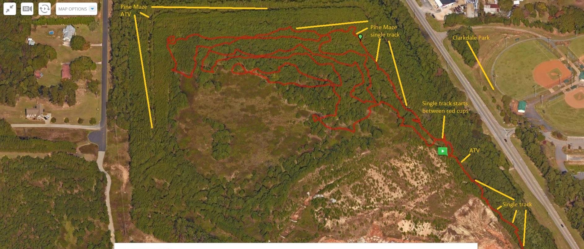 Aerial view map of a wooded area indicating a Pine Maze and ATV trails. Red lines mark the various single-track paths, with labeled starting points and nearby landmarks such as Clarkdale Park. The map includes surrounding roads and residential areas. Austell Threadmill MTB Park (Closed) mountain bike trail.