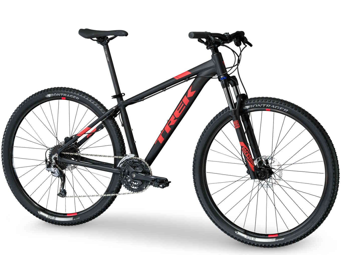 Trek 2017 Trek Marlin 7: A black and red mountain bike with a sturdy frame, featuring wide tires designed for off-road terrain, visible gears, and a front suspension fork. The bike is positioned against a plain background, showcasing its design and components.
