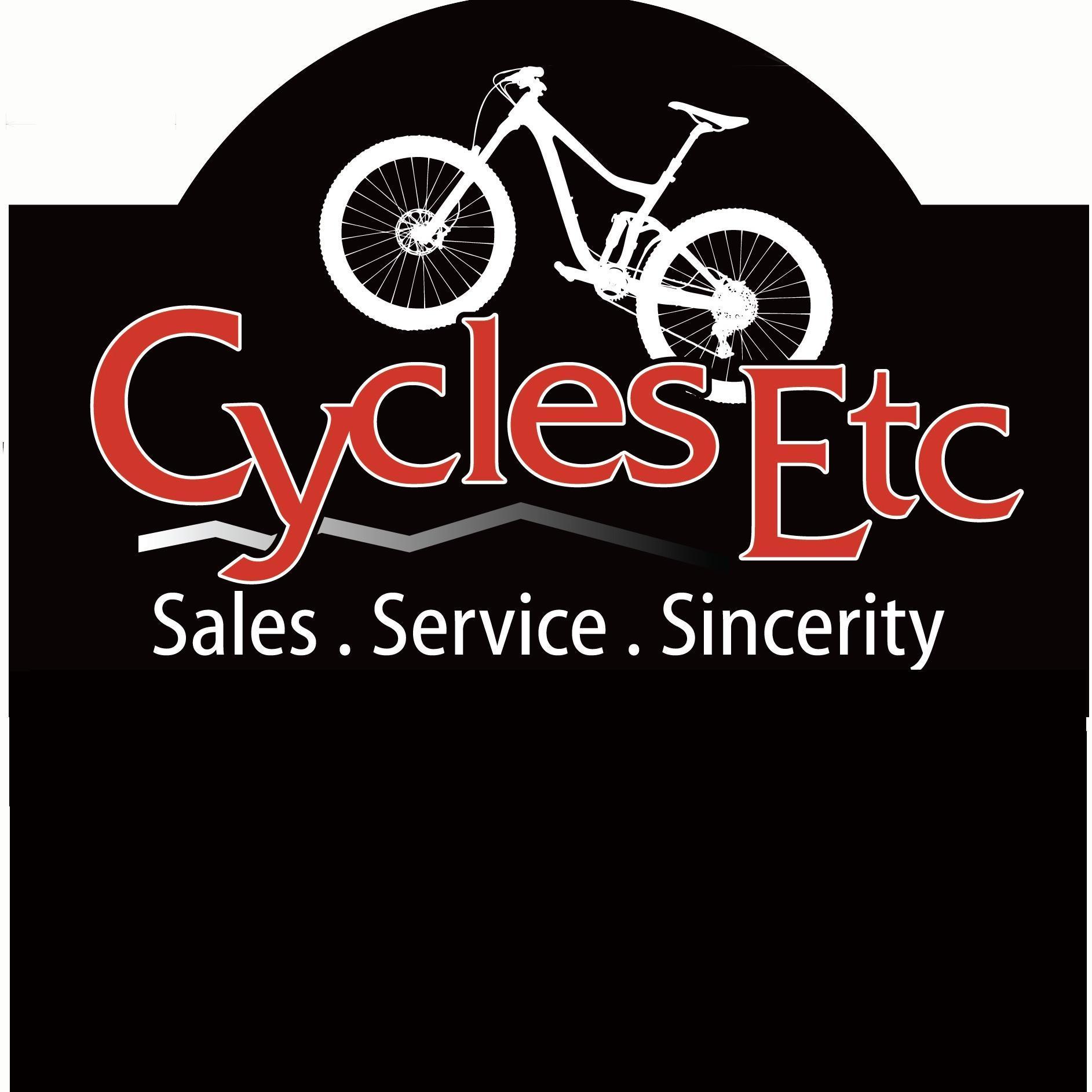 Logo for "Cycles Etc," featuring a stylized white mountain bike illustration above the text. The logo includes the tagline "Sales . Service . Sincerity" in a bold, red font on a black background.