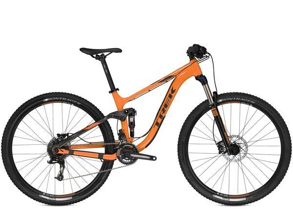 Trek Fuel EX 5 29: A bright orange mountain bike with a sleek design, featuring a sturdy frame, front suspension, and wide tires suited for off-road terrain. The bike is equipped with hydraulic disc brakes and a comfortable saddle for an enhanced riding experience.
