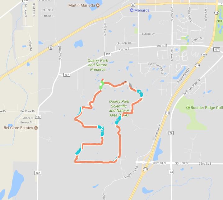 Map of Quarry Park and Nature Preserve, highlighting the Quarry Park Scientific and Natural Area with marked trails and nearby landmarks. The map shows various roads and surrounding areas. Quarry Park And Nature Preserve mountain bike trail.