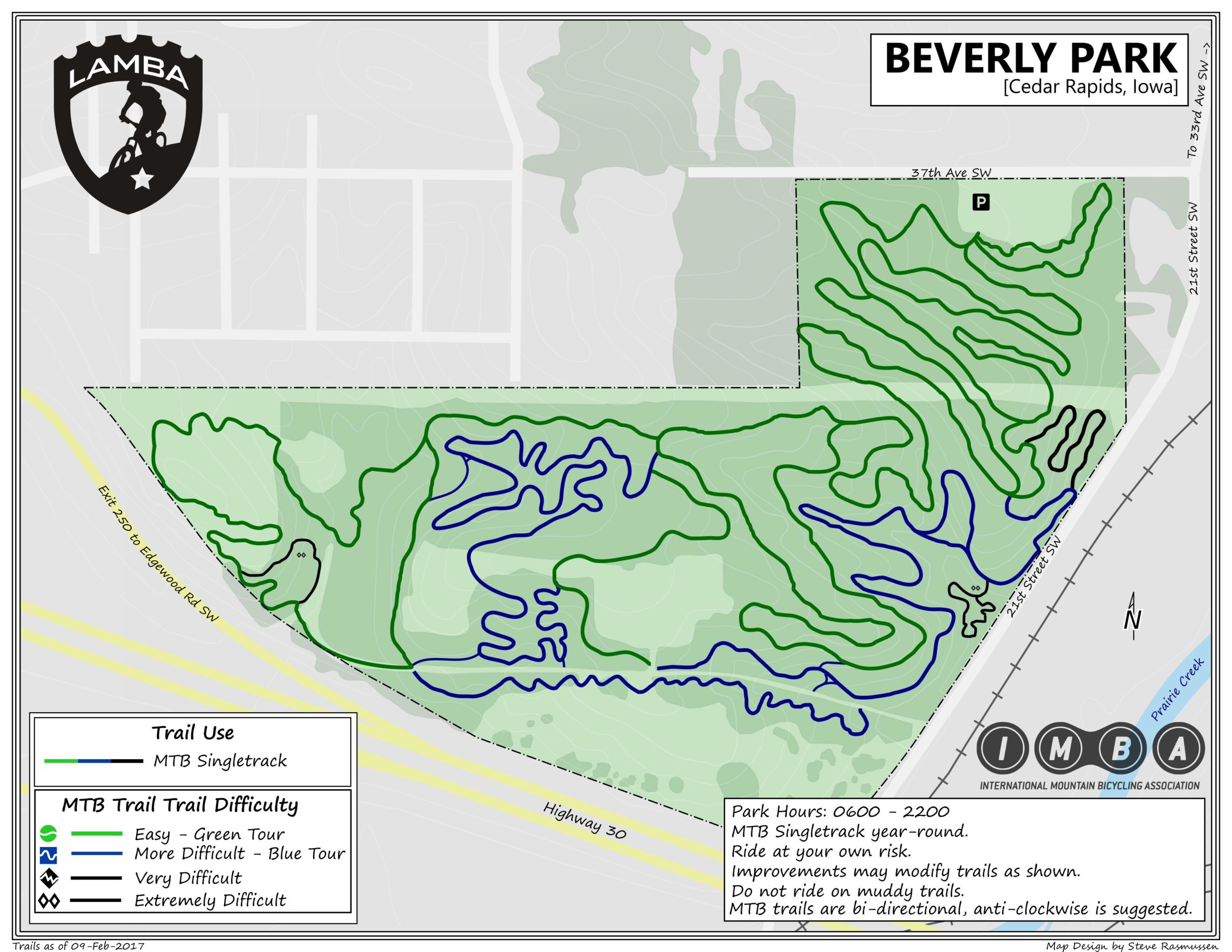 A detailed map of Beverly Park in Cedar Rapids, Iowa, showing mountain biking trails. The map highlights different trail difficulties using color coding: green for easy trails, blue for more difficult trails, black for very difficult trails, and red for extremely difficult trails. It includes information on park hours, trail direction, and park usage guidelines. The map features surrounding roads and landmarks for orientation. Beverly Park mountain bike trail.