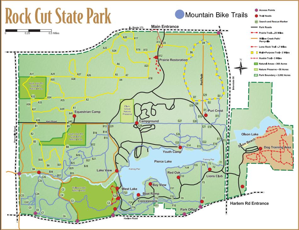 Map of Rock Cut State Park, displaying the layout of mountain bike trails, access points, park roads, campgrounds, and natural areas. Key features include various trail routes, lakes, an equestrian camp, and the main park entrance. The map includes labeled areas for recreational activities such as fishing and camping. Rock Cut State Park mountain bike trail.