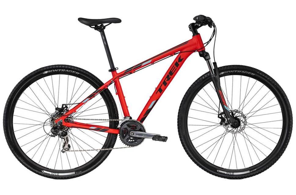 Trek Marlin 5 29er: A red Trek mountain bike with a sleek frame, featuring front suspension, disc brakes, and knobby tires suitable for off-road riding.