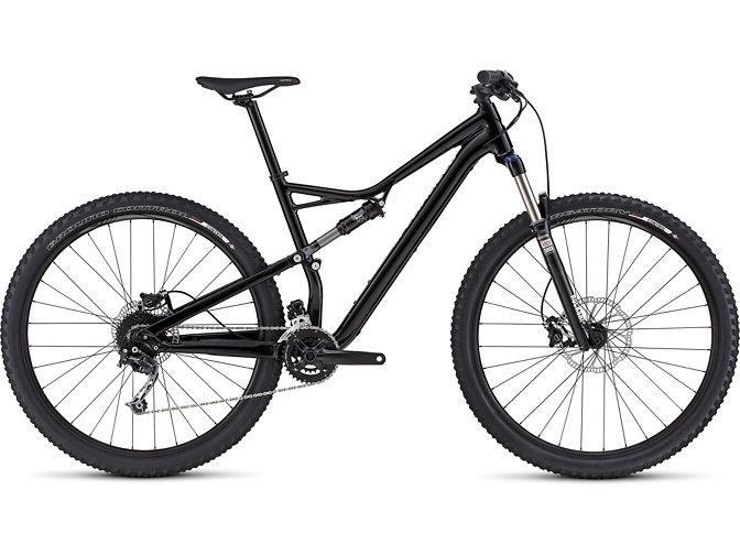 Specialized Camber 29: Alt tag: A sleek black mountain bike with a lightweight aluminum frame, front suspension, and knobby tires, positioned sideways to showcase its design features.