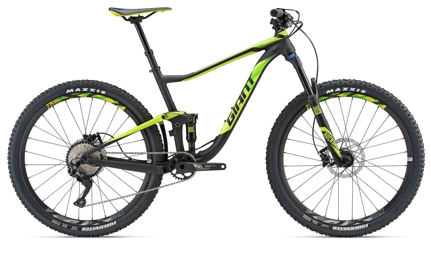 Giant Anthem 27.5 3: A black and neon green mountain bike with wide tires and a suspension system, featuring a dropper seat post, disc brakes, and a Shimano drivetrain. The bike is angled to the side, showcasing its rugged design suitable for off-road trails.
