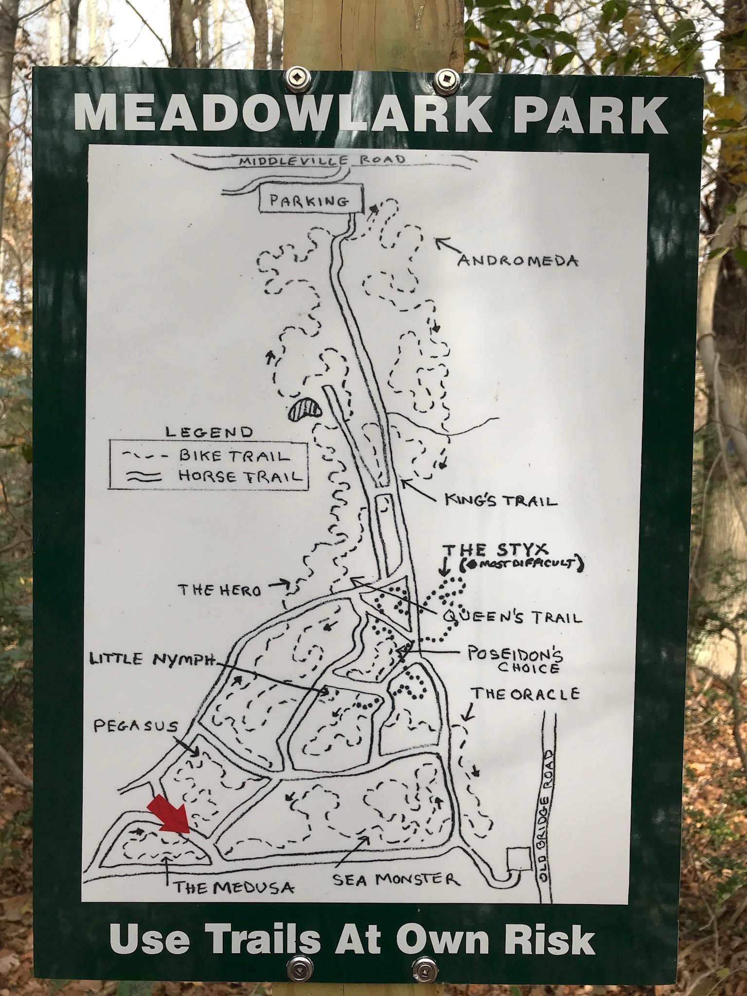 Map of Meadowlark Park showing various trails, including bike and horse trails. Notable paths include Andromeda, The Hero, Little Nymph, Pegasus, The Medusa, and The Styx, which is marked as the most difficult. The map indicates parking locations and advises users to use trails at their own risk. Meadowlark Park mountain bike trail.