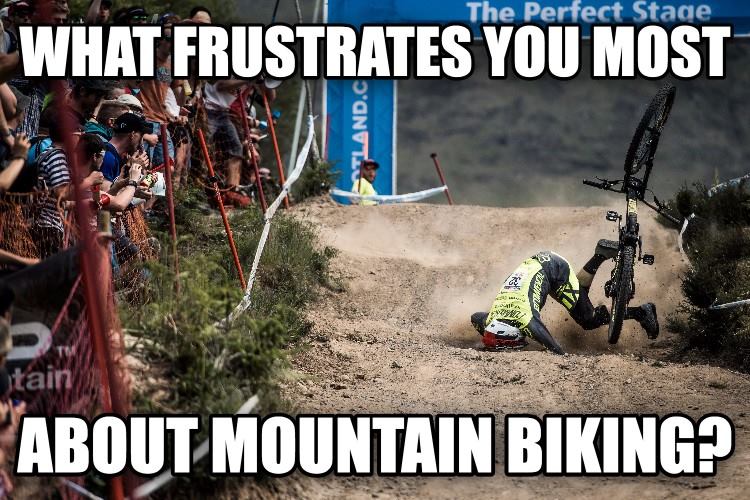 A mountain biker falling over on a dirt track during a race, surrounded by spectators. The image includes bold text overlay asking, "What frustrates you most about mountain biking?"
