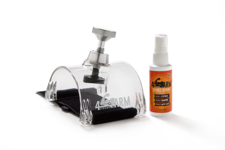A clear tool designed for muscle recovery, featuring a silver knob for adjustment, alongside a bottle of sport spray labeled "4ARM" that claims to reduce stiffness, cramping, and lactic acid. The setup is positioned on a light background.