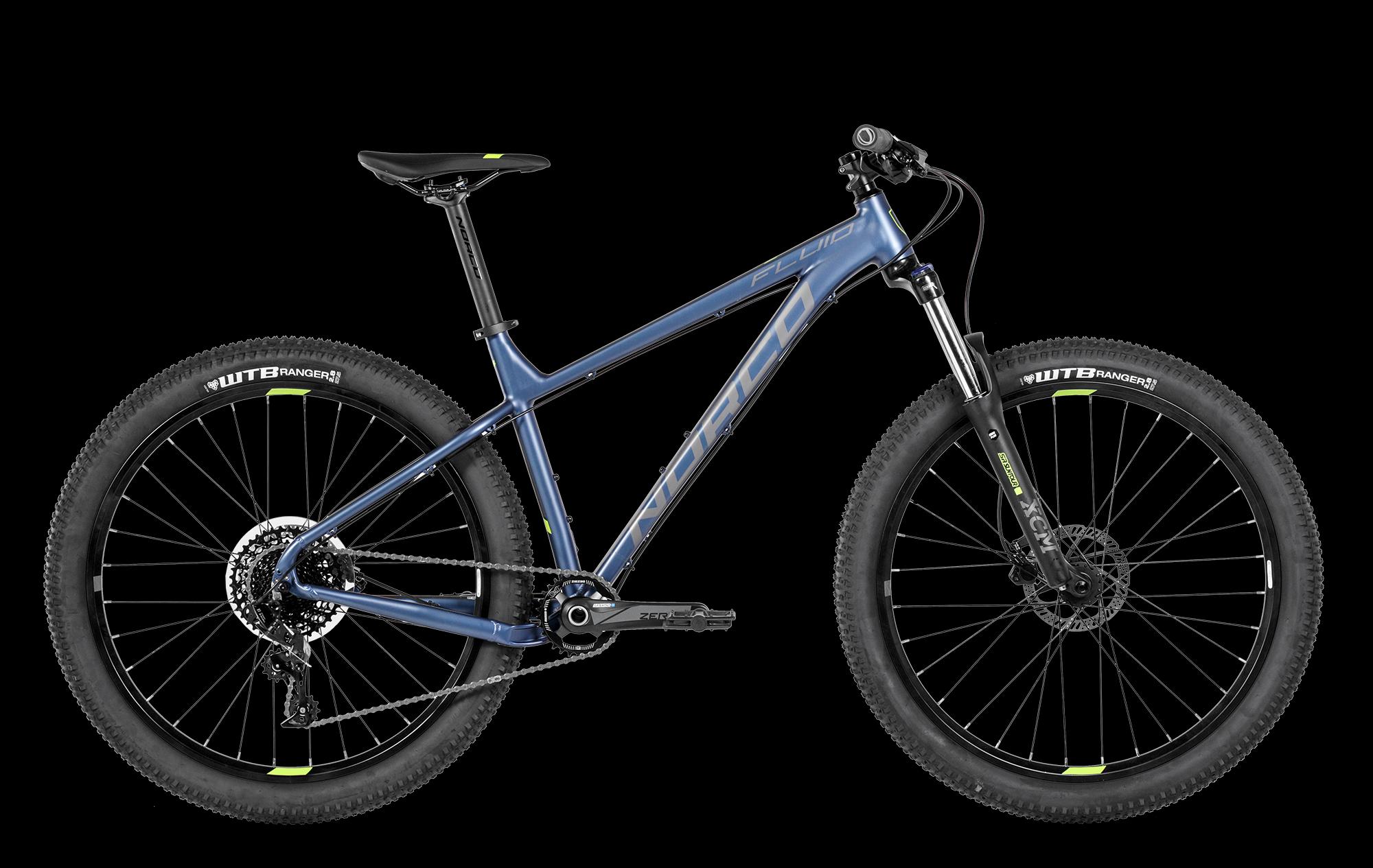 Norco FLUID 3 HT: A blue mountain bike with wider tires and a sleek design, featuring a front suspension fork, disc brakes, and a modern frame. The bike is displayed against a black background, showcasing its components and brand name clearly.