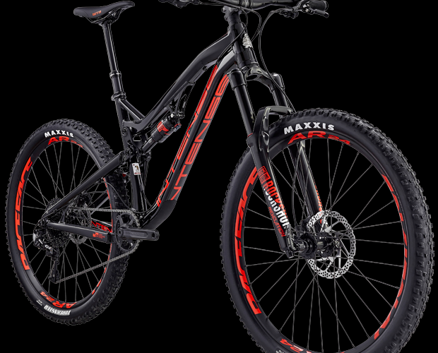 Alt text: A black and red mountain bike with a sleek design, featuring wide tires and a front suspension fork. The bike is set against a black background, showcasing its frame and components clearly.
