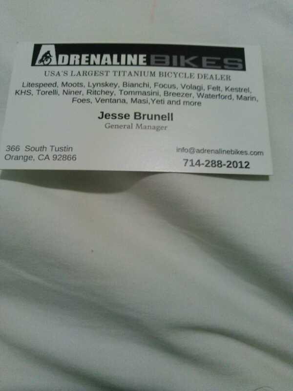 A business card for Adrenaline Bikes, featuring the text "USA