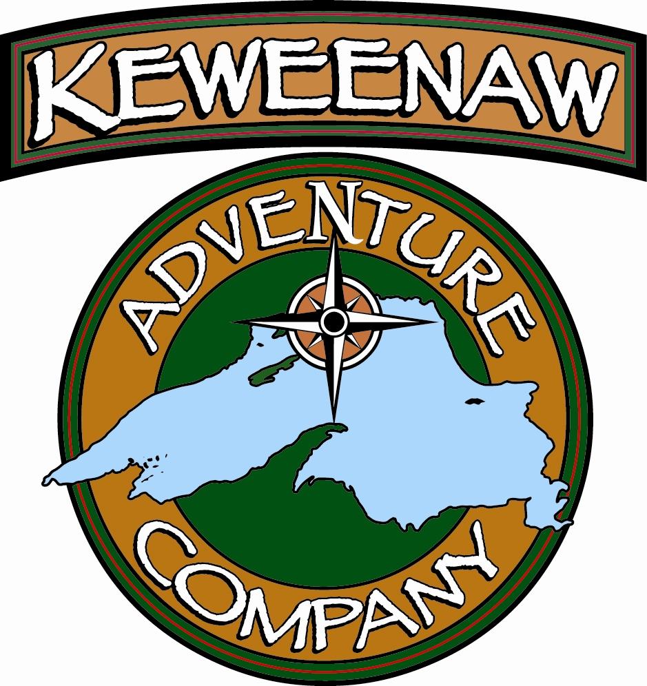 Logo for Keweenaw Adventure Company featuring a stylized depiction of the Keweenaw Peninsula in blue, surrounded by circular text that reads "ADVENTURE COMPANY" above a brown background, with a compass design in the center. 