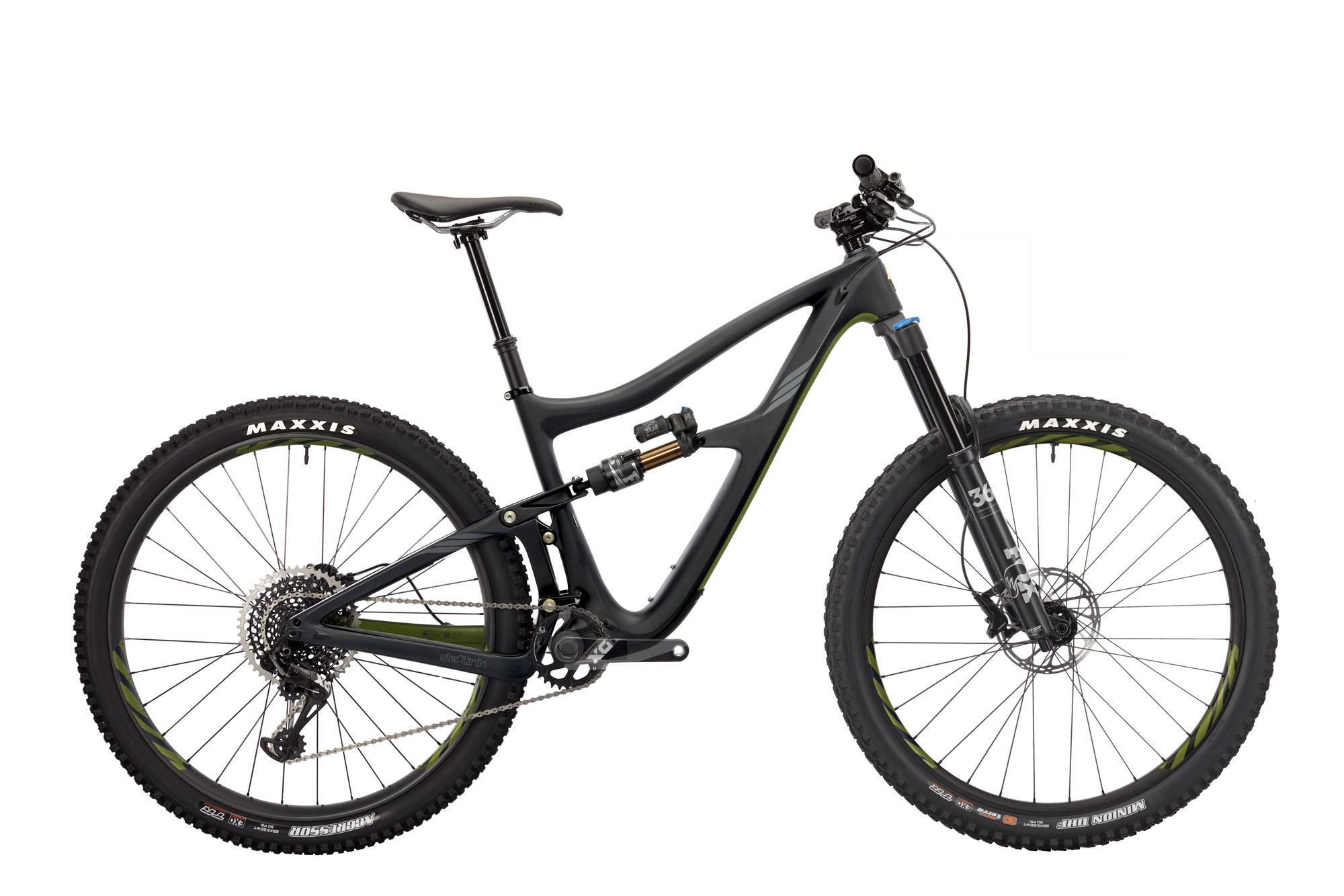 Ibis RipMo: A black mountain bike with green accents, featuring wide tires and a suspension setup. The bike is positioned against a white background, showcasing its sleek frame design, adjustable seat post, and a detailed gear system on the rear wheel.