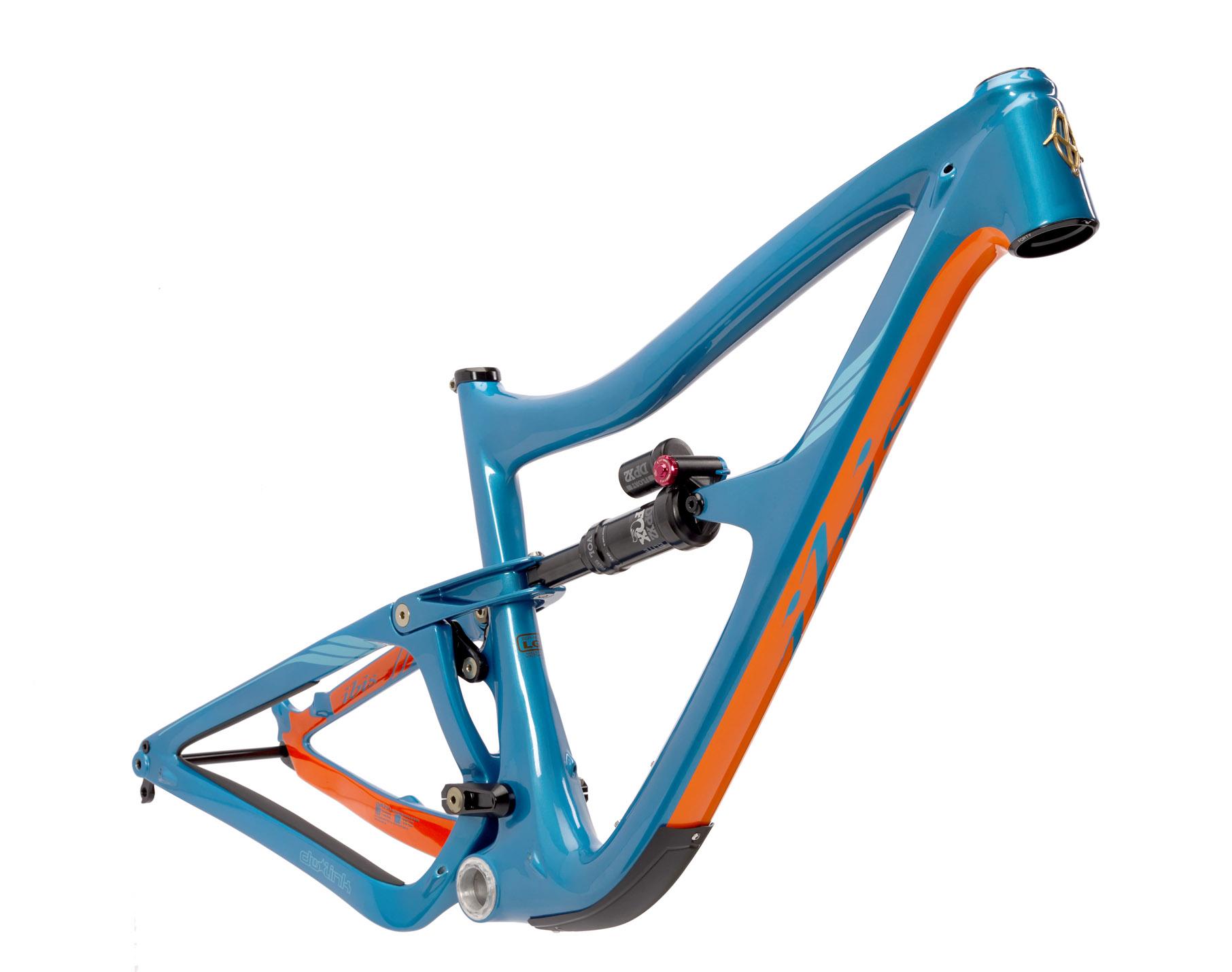 Ibis RipMo: A close-up image of a bicycle frame in a vibrant blue and orange color scheme, featuring smooth curves and a modern design. The frame includes a shock absorber and visible mounting points, set against a white background.
