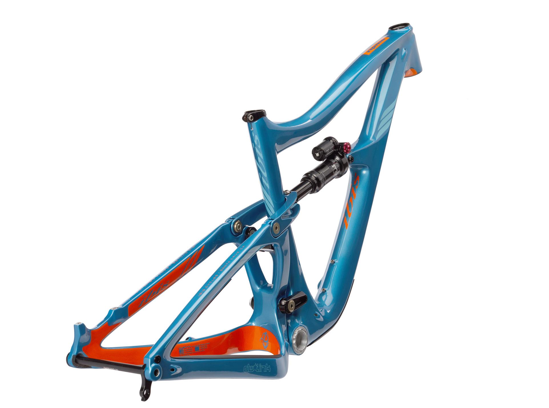 Ibis RipMo: A vibrant blue mountain bike frame with orange accents, showcasing its design and suspension system, positioned on a white background.