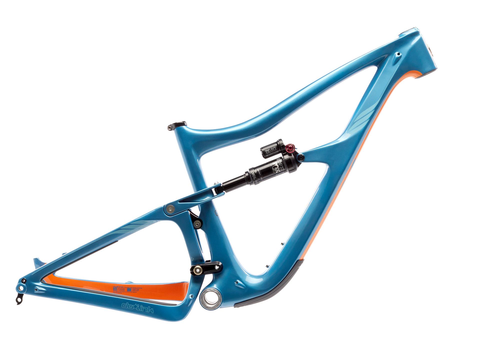 Ibis RipMo: A blue mountain bike frame with orange accents, featuring a shock absorber mounted on the rear triangle. The frame has a sleek, modern design with visible suspension components.