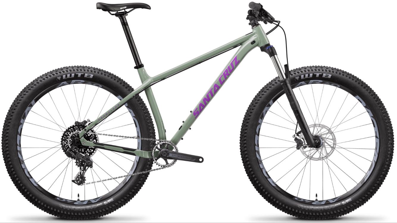 2017 Santa Cruz Chameleon: A green fat bike with wide tires, featuring the brand name "Santa Cruz" in purple on the frame. The bike has a sleek design suitable for off-road riding, with a straight handlebar and a single gear system visible on the rear wheel. The wheels are equipped with WTB tires, emphasizing durability for various terrains.