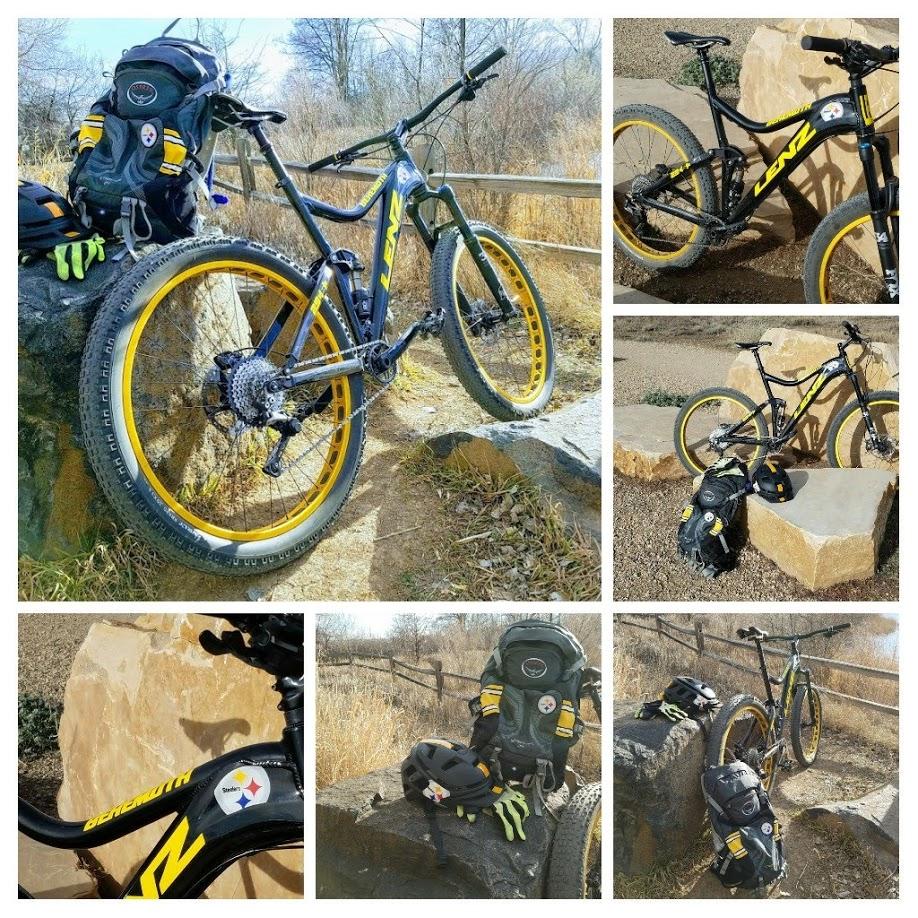 Lenz Sport Behemoth: Alt text: A collage of images featuring a mountain bike with yellow rims, parked on rocks in a natural outdoor setting. The bike has “Lenz” written on the frame and shows details of its components. A black backpack and helmet are placed beside the bike, featuring distinct logos. The surrounding area includes grass and a wooden fence, with trees in the background.