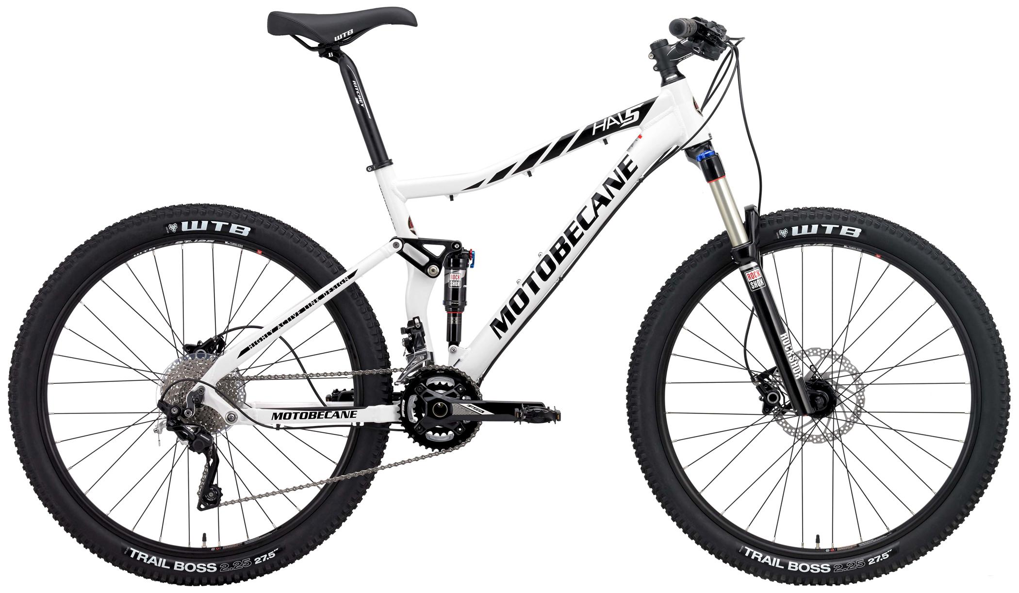 A white Motobecane mountain bike with dual suspension, featuring a sleek frame design, 27.5-inch WTB Trail Boss tires, and a responsive gear system. The bike is displayed sideways, highlighting its components including disc brakes and adjustable seat post.