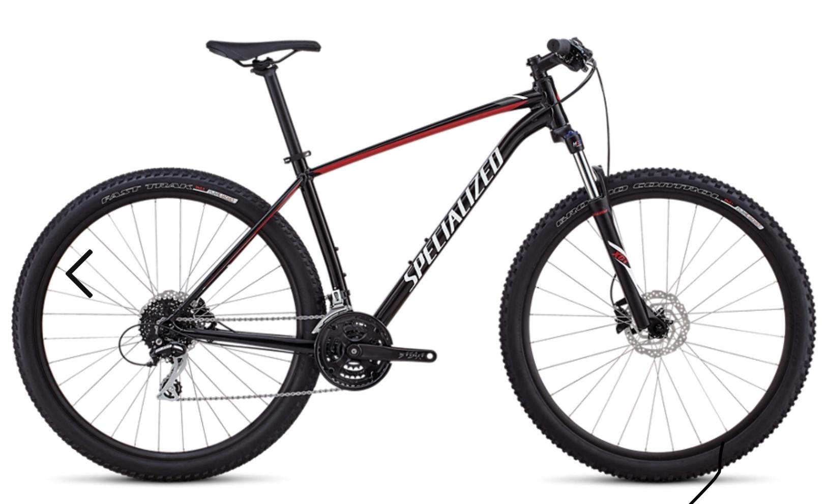 Specialized Rockhopper 29: An image of a black and red mountain bike, featuring a lightweight frame, wide tires, and disc brakes. The bike has a sleek design with 'Specialized' branding on the frame, showcasing a gear system and a prominent rear cassette. Ideal for off-road riding and rugged terrains.