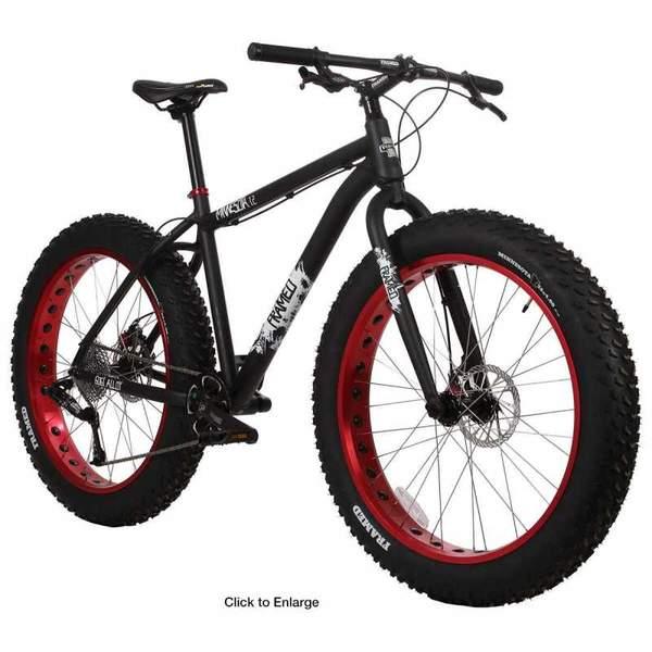 Framed Minnesota 1.0: A black and red fat bike with oversized tires, showcasing a sporty design and frame suitable for rugged terrain. The bike features a sleek black frame with red accents on the wheels and tires, designed for stability and traction.