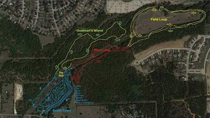 Map of wooded trails showing different routes, including Goatman's Island, Field Loop, West Loop, and South Town, denoted by colored lines (yellow, red, and blue) on a satellite imagery background. The map also includes labeled points of interest and a legend for trail navigation. Chisenhall trails mountain bike trail.