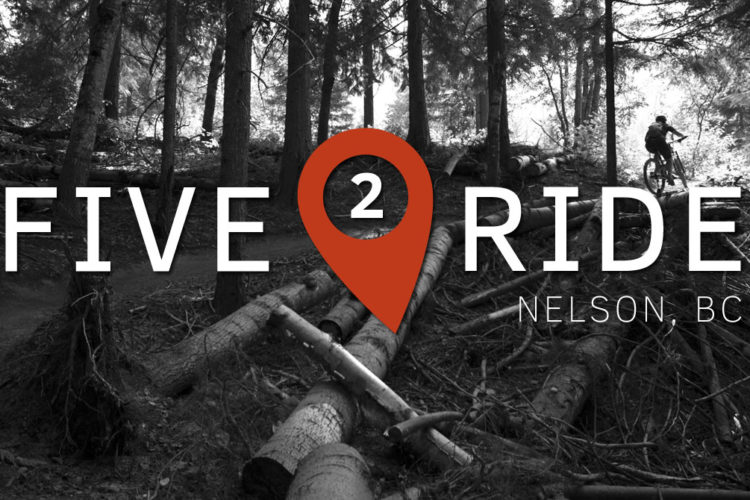 A scenic view of a forested mountain biking trail in Nelson, BC, featuring the text "FIVE 2 RIDE" prominently displayed in white and an orange location pin symbol. In the background, a cyclist can be seen biking through the trees on the trail surrounded by logs and natural foliage.
