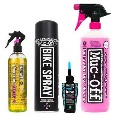 Five bike cleaning and maintenance products arranged in a row. The products include a bike cleaner spray bottle, a can of bike spray, a bottle of wet lube, and a cleaner labeled as "fast action bike cleaner," in vibrant packaging with distinct colors and branding.