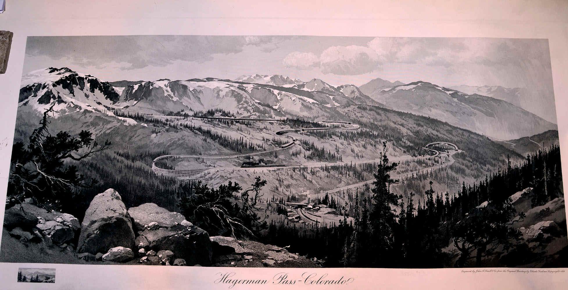 A black and white illustration of Hagerman Pass in Colorado, showcasing a winding road through mountainous terrain. The landscape features snow-capped peaks, dense forests, and rocky outcrops, with a valley below. The artistic style emphasizes the dramatic elevation changes and natural beauty of the area. Hagerman Tunnel mountain bike trail.