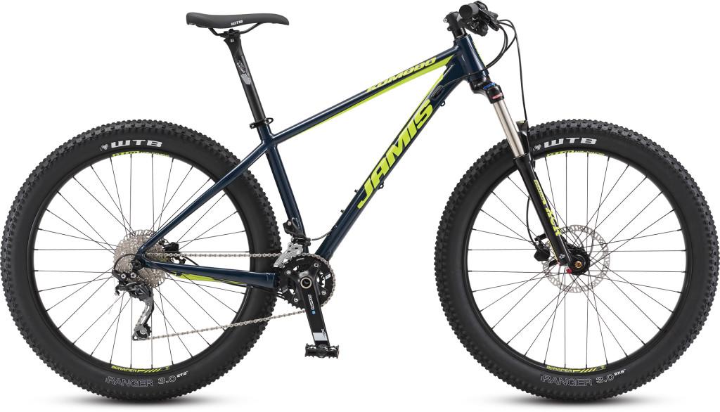 Jamis Komodo: A blue and yellow mountain bike with wide tires, featuring a sturdy frame and a front suspension fork. The bike has a modern design, with the brand name prominently displayed. The wheels are equipped with WTB Ranger tires, indicating suitability for off-road riding.